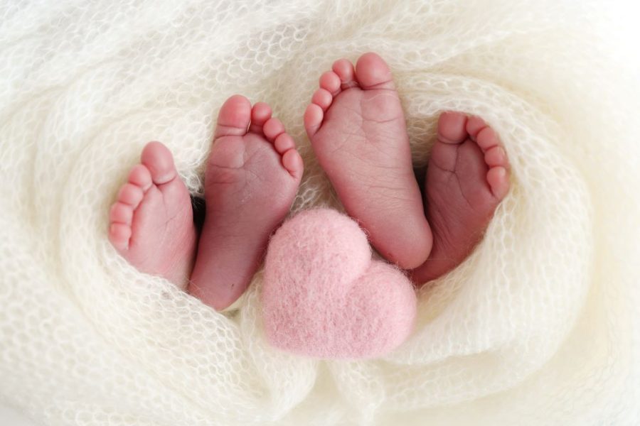 The feet of two babies born from twins.
