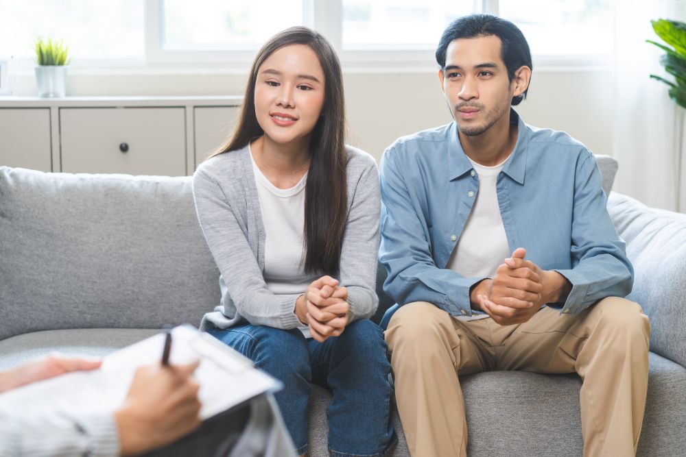 A couple who consulted a doctor about infertility after a miscarriage.